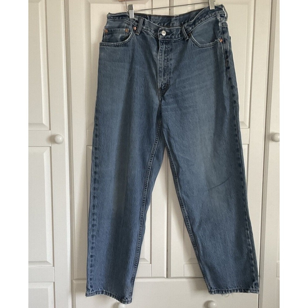 Levi's 560 Denim Blue Jeans Tapered Leg Men's  Size 36x30 Distressed‎ Hem